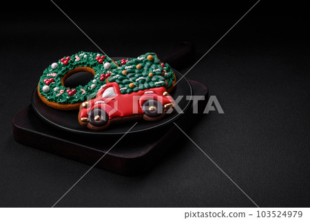 Delicious beautiful Christmas gingerbread cookies on a textured concrete background Delicious beautiful Christmas gingerbread cookies on a textured concrete background 103524979