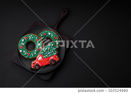 Delicious beautiful Christmas gingerbread cookies on a textured concrete background 103524980