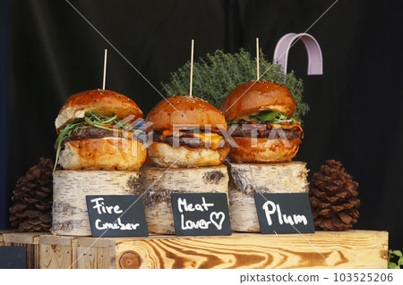 Hamburgers displayed at snack stand at farmers market Hamburgers displayed at snack stand at farmers market 103525206