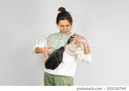 Woman with Black Leather Crossbody Fanny Pack Bag Woman with Black Leather Crossbody Fanny Pack Bag 103526748