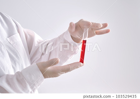Test tube with blood in the hand. Test tube with blood in the hand. 103529435