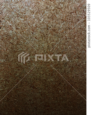 Vertical background image of a dark tan particleboard surface with compressed small pieces of wood Vertical background image of a dark tan particleboard surface with compressed small pieces of wood 103529509