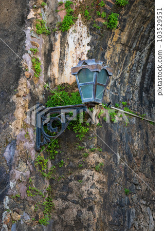Old colonial-style decayed street lamp on the Galle Fort arch entrance Old colonial-style decayed street lamp on the Galle Fort arch entrance 103529551