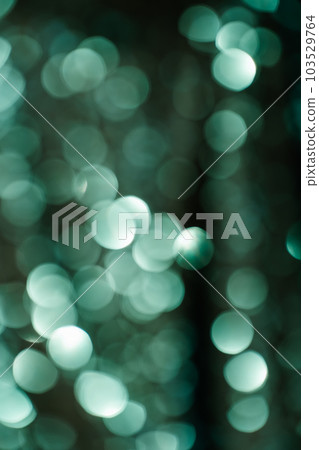 Abstract bokeh background of emerald green color. Abstract bokeh background of emerald green color. 103529764