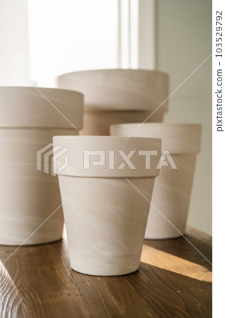 The texture of terracotta pots in close-up. The texture of terracotta pots in close-up. 103529792