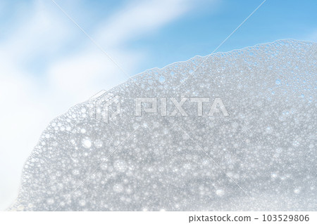 Texture of white foam on a sky background. 103529806
