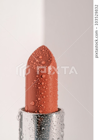 Moisturizing lipstick with water drops on it. 103529832