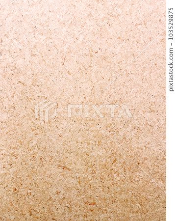 Vertical background image of a light brown particleboard surface with compacted small pieces of wood 103529875