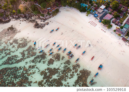 Beautiful Koh lipe island with tropical sea, fishing boat and resort on the beach in summer 103529918