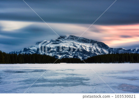 Two Jack Lake with Mount Rundle in winter on the evening at Banff national park 103530021