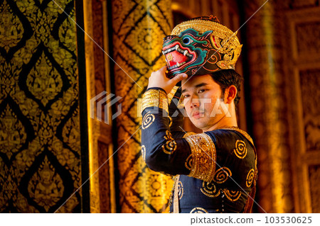 Close up Asian man with traditional cloth relate to Khon or Thai classic masked with holding mask 103530625