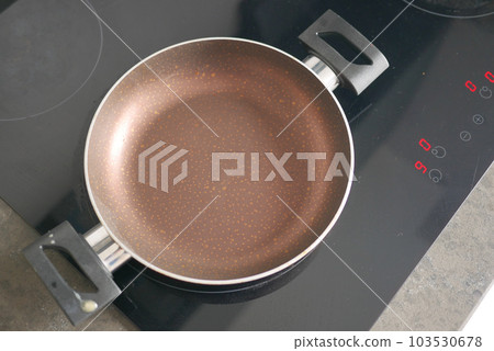 cooking pan on electric stove, electric stove is heated to red. cooking pan on electric stove, electric stove is heated to red. 103530678