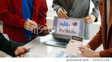 Business team meeting present.professional investor working with Finance managers task. with laptop smart phone and digital tablet in morning light. Business team meeting present.professional investor working with Finance managers task. with laptop smart phone and digital tablet in morning light. 103531129