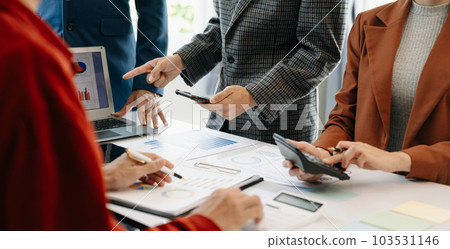 Businessman and team analyzing financial statement Finance task. with smart phone and laptop and tablet. Wealth management concept. Businessman and team analyzing financial statement Finance task. with smart phone and laptop and tablet. Wealth management concept. 103531146