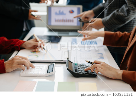 Businessman and team analyzing financial statement Finance task. with smart phone and laptop and tablet. Wealth management concept. Businessman and team analyzing financial statement Finance task. with smart phone and laptop and tablet. Wealth management concept. 103531151