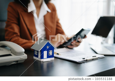 Considering buying a home, investing in real estate. Broker signs a sales agreement. agent, lease agreement, successful deal . Considering buying a home, investing in real estate. Broker signs a sales agreement. agent, lease agreement, successful deal . 103531188