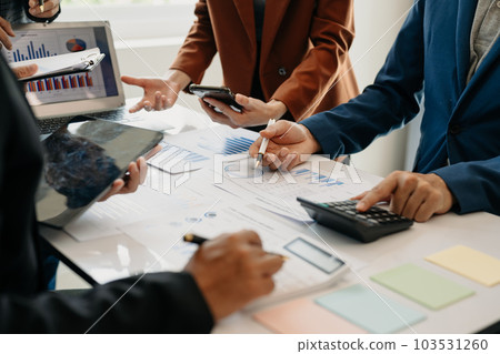 Business team meeting present.professional investor working with Finance managers task. with laptop smart phone and digital tablet in morning light. Business team meeting present.professional investor working with Finance managers task. with laptop smart phone and digital tablet in morning light. 103531260