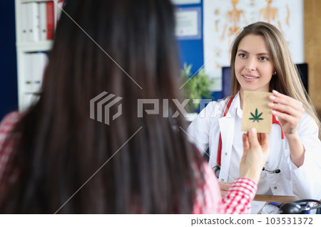 Sick patient with paper bag with cannabis symbol closeup Sick patient with paper bag with cannabis symbol closeup 103531372