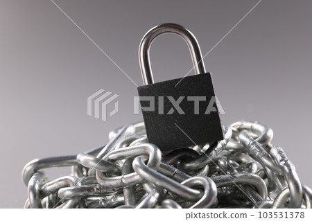 Control lock and chain on gray background concept 103531378