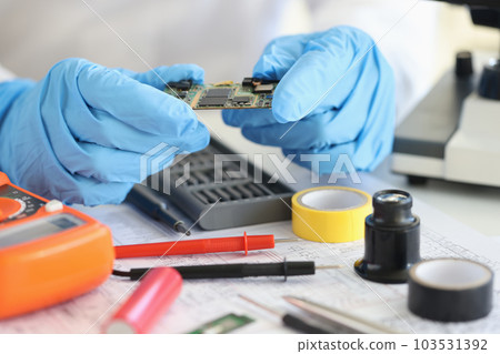 Chip and motherboard repair engineer. Repair of computer equipment and microprocesses and phones Chip and motherboard repair engineer. Repair of computer equipment and microprocesses and phones 103531392