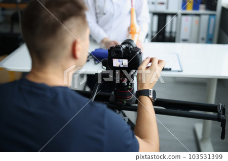 Videographer filming medical training on orthopedics doctor blogger Videographer filming medical training on orthopedics doctor blogger 103531399