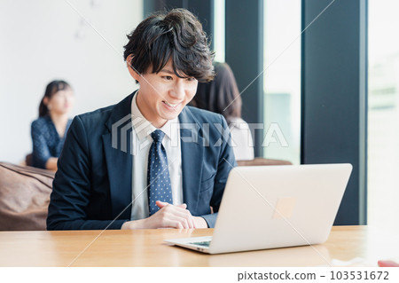 Businessman giving a presentation at a web conference 103531672