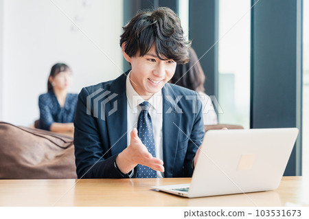 Businessman giving a presentation at a web conference 103531673