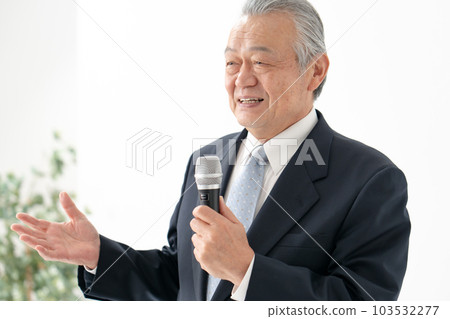 Senior male business with a microphone 103532277