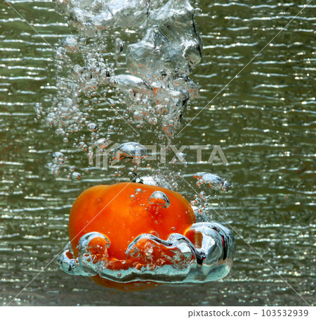 Splash of a red tomato Splash of a red tomato 103532939