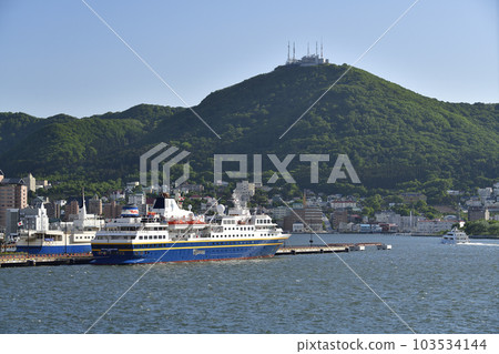 Photographing the scenery of the cruise ship Heritage Adventure that calls at Hakodate Port in Hakodate City, Hokkaido in early summer 103534144