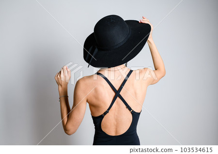 Sexy woman back in brimmed felt hat Sexy woman back in brimmed felt hat 103534615