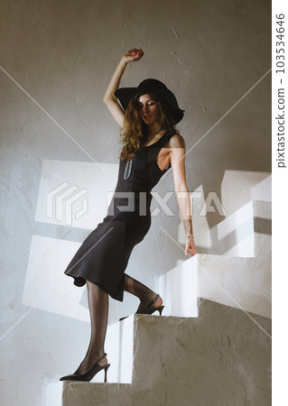 Woman in heels dance on concrete stairs 103534646