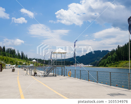 Empty Lake of Youth beach in Bukovel in summer 103534976