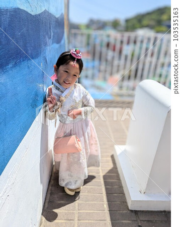 A girl in Korean national costume touring Gamcheon Culture Village in Busan 103535163