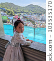 A girl in Korean national costume touring Gamcheon Culture Village in Busan 103535170