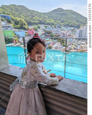 A girl in Korean national costume touring Gamcheon Culture Village in Busan 103535170