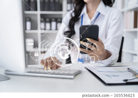 Person typing laptop computer and tablet with SDK icon on virtual screen. SDK Software development kit programming language technology concept in office. Person typing laptop computer and tablet with SDK icon on virtual screen. SDK Software development kit programming language technology concept in office. 103536823