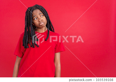 African woman with sad expression looking away African woman with sad expression looking away 103539108