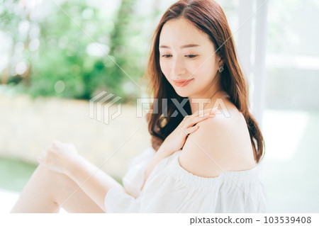 Young woman doing skin care, UV care Young woman doing skin care, UV care 103539408