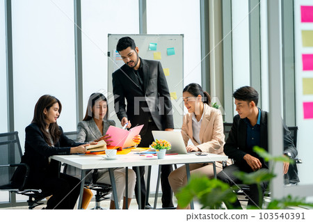 Group of business man and woman sit around the table to discuss about project with the manager Group of business man and woman sit around the table to discuss about project with the manager 103540391