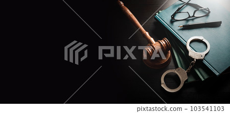 Handcuffs and wooden gavel. Law concept Handcuffs and wooden gavel. Law concept 103541103