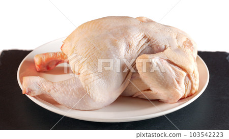 Raw chicken on white plate isolated on white background ready for cooking 103542223