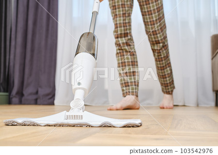Mopping floors with modern swab Mopping floors with modern swab 103542976