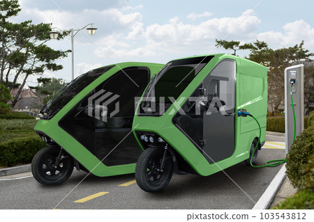 Delivery electric tricycle scooters with charging station on city street Delivery electric tricycle scooters with charging station on city street 103543812