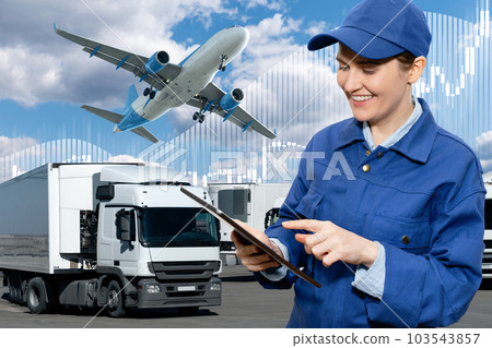 Manager with a digital tablet on a background of airplane and trucks. International trade and logistics concept Manager with a digital tablet on a background of airplane and trucks. International trade and logistics concept 103543857