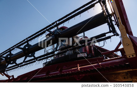 Close up of combine harvester for harvesting wheat Close up of combine harvester for harvesting wheat 103543858
