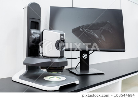 Optic machine for precise measurement of part size and quality evaluation. Smart factory. Optic machine for precise measurement of part size and quality evaluation. Smart factory. 103544694