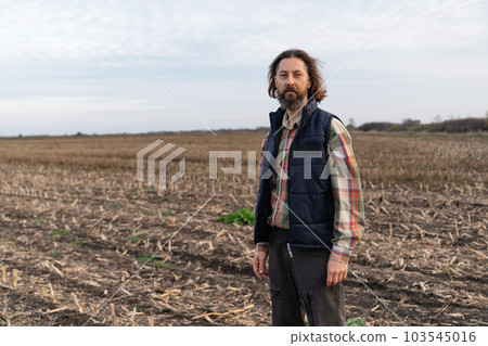 Portrait of bearded farmer on a field 103545016