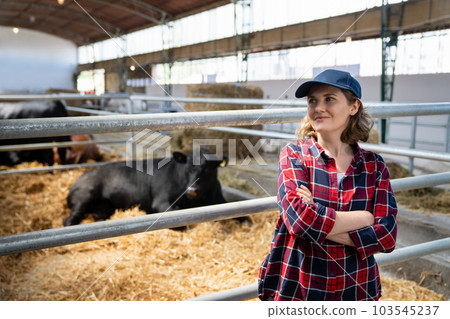 Woman farmer at a dairy farm 103545237