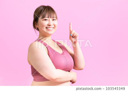 Portrait of plus size model in sportswear 103545349